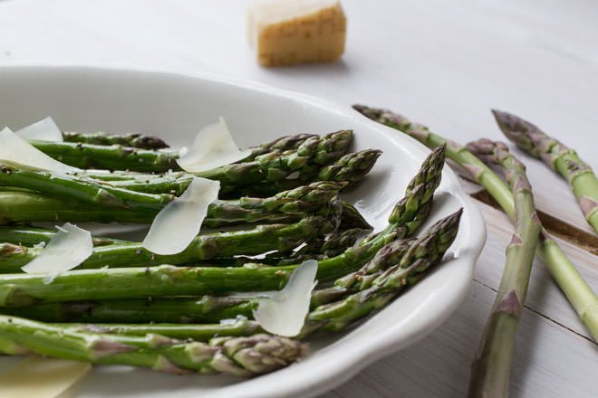 A delicious appetizer made of quick-roasted asparagus, Parmesan cheese, olive oil, salt and pepper. Simple flavors have never been so good!