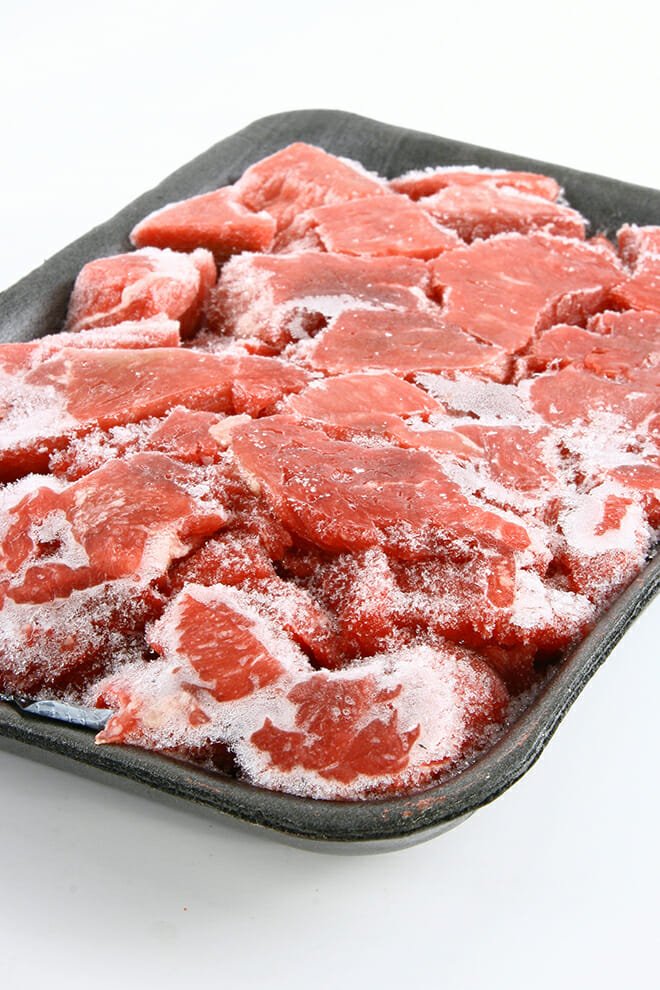 Sheet pan of frozen steaks,