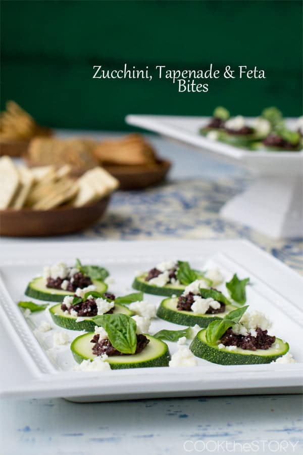 Zucchini, Tapenade and Feta Cheese Bites on a white platter.