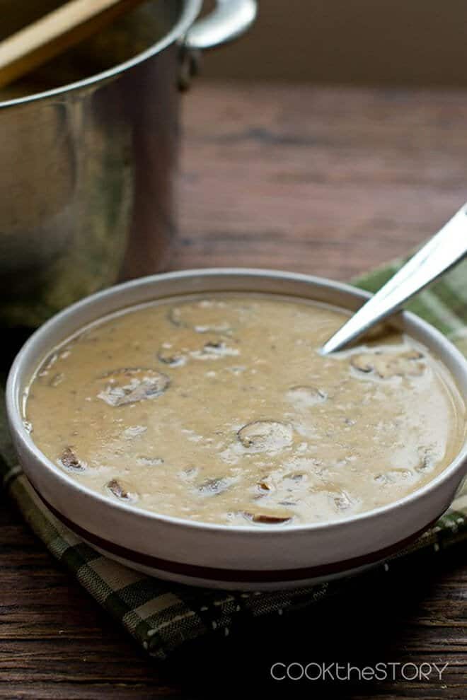 Cream of Mushroom Soup in a bowl with a spoon.