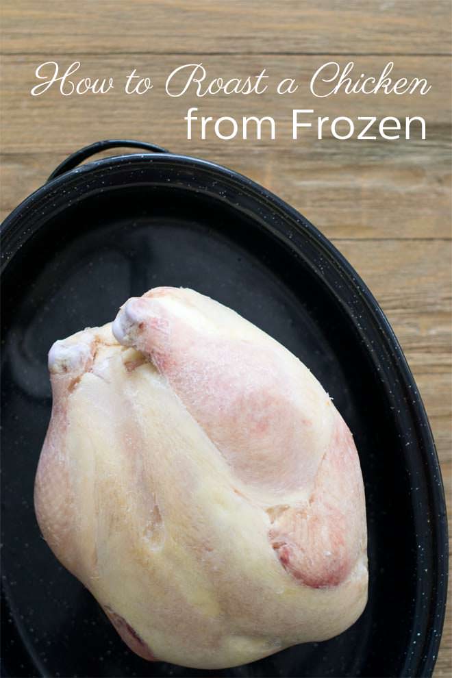 Frozen whole chicken in a roasting pan.