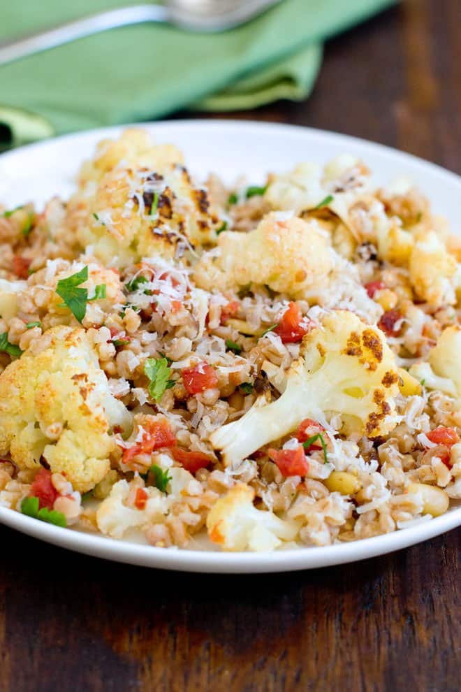 Farro salad with cauliflower, topped with grated Parmesan.