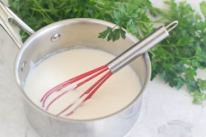 Learn how to make the classic French béchamel with tips for making it perfectly, from the ratios of flour to butter to milk to how to store it and more. This sauce is used in many things, from Mac 'n' Cheese to souffles to lasagna. Getting it down will make you a master in the kitchen.