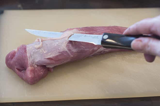 Use a boning knife to cut between the silver skin and the meat of the pork tenderloin