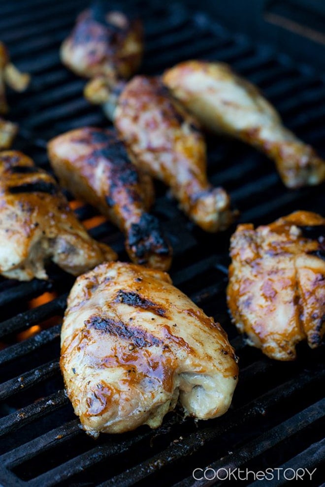 Various cuts on chicken on the grill, juicy and with grill marks.