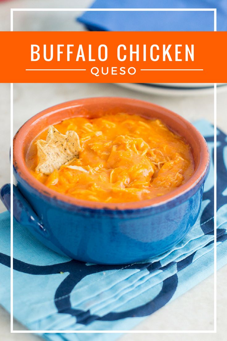 Buffalo Chicken Queso with a tortilla chip dipped in.