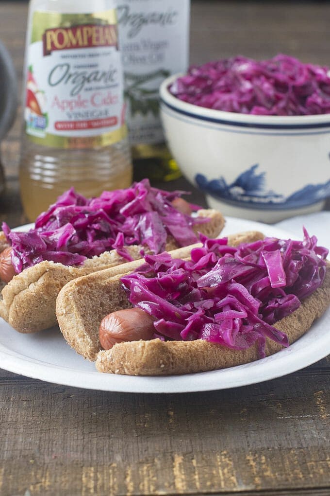 Our quick homemade red cabbage sauerkraut gives grilled hot dogs a beautiful grown up twist.