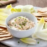 Smoked Trout Dip surrounded by crackers and endive.