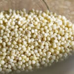 A jar with uncooked millet in it