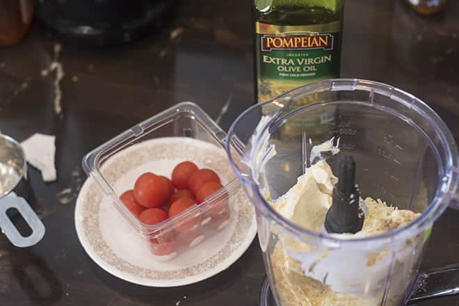 Combine cheeses in food processor.