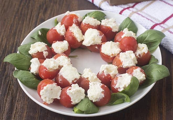 Caprese Salad Wreath on white plate.