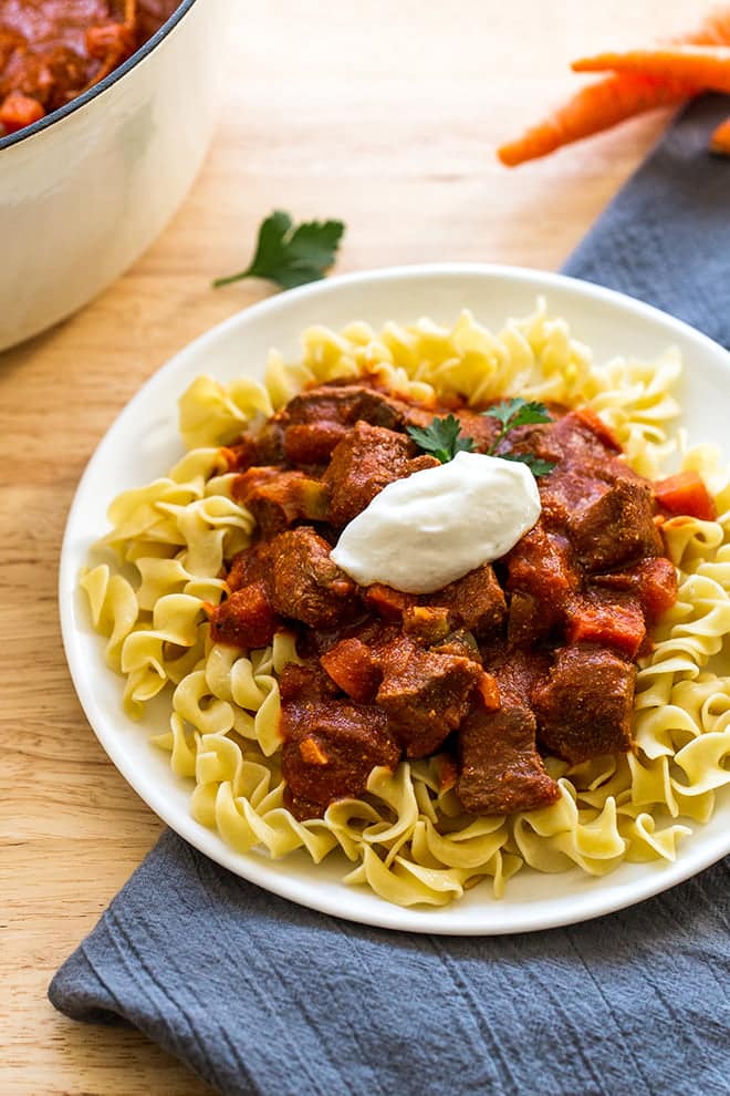 Traditional Hungarian Goulash is the definition of comfort food. Rich tomato sauce with paprika and tender beef.