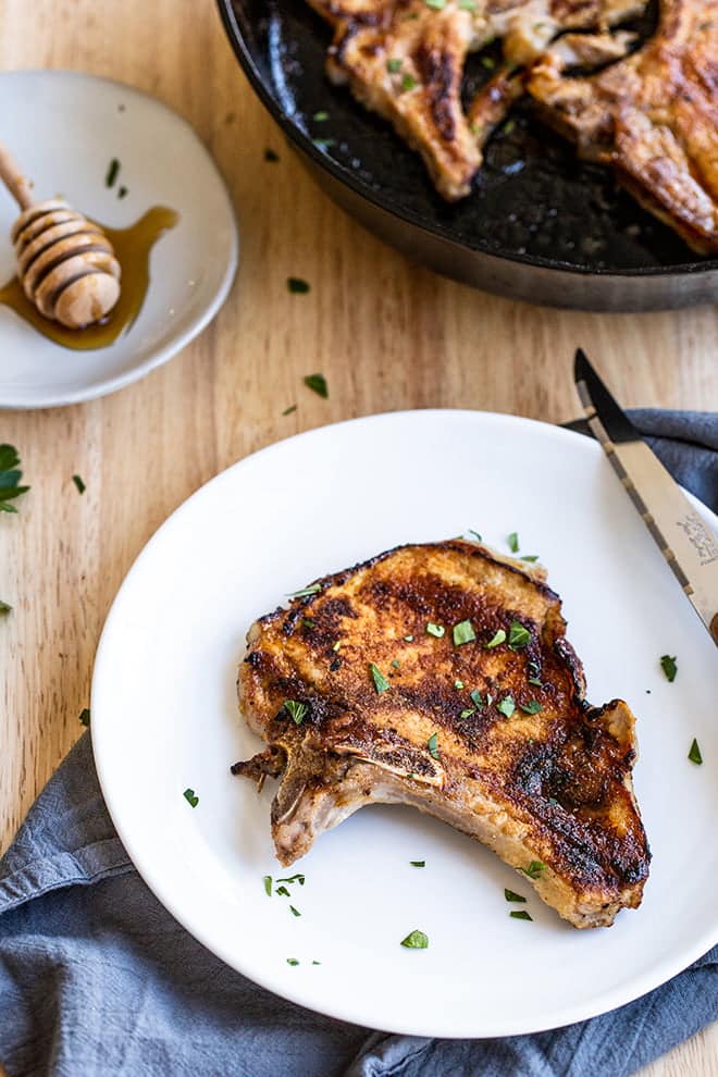 These juicy pork chops are marinated in honey and garlic before they're seared in a hot pan. I then brush them with a honey garlic glaze before they finish cooking in the oven. 
