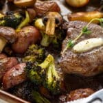 Tender, juicy steak surrounded by a colorful assortment of roasted vegetables
