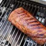 Pork Loin on a grill with crispy exterior and grill marks.