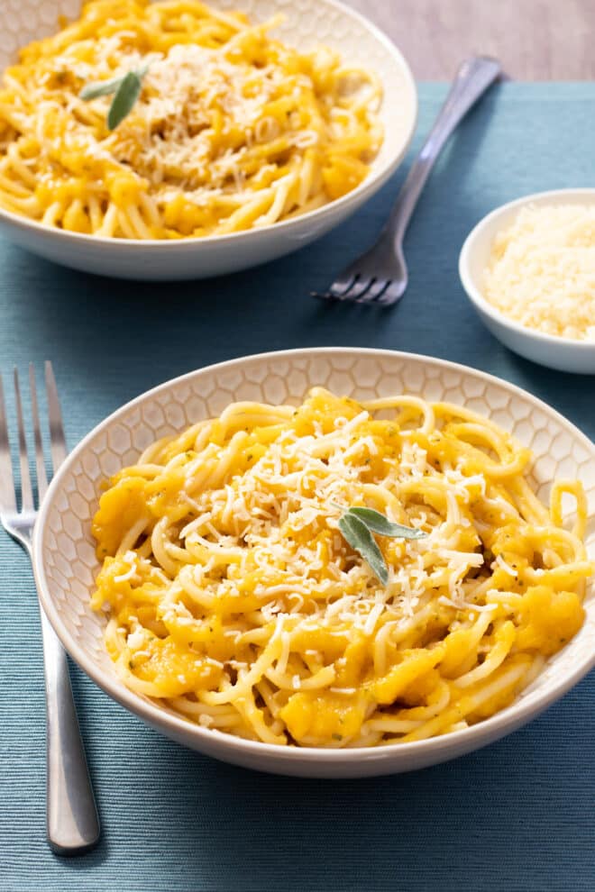 Pasta with butternut squash sauce, topped with Parmesan and sage.