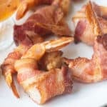 Bacon wrapped shrimp on a plate