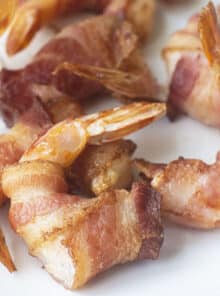 Bacon wrapped shrimp on a plate