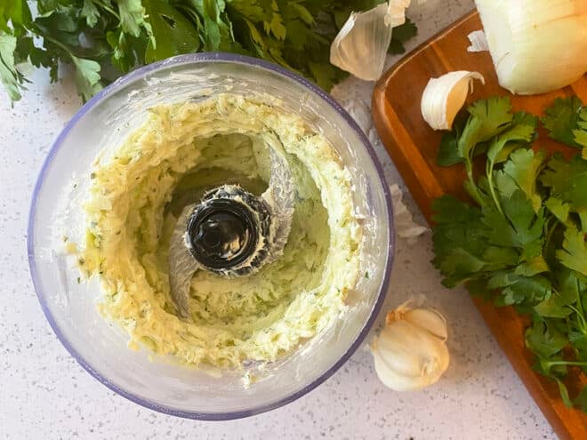 Smooth garlic butter in food processor.