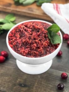 White bowl of fresh cranberry relish.