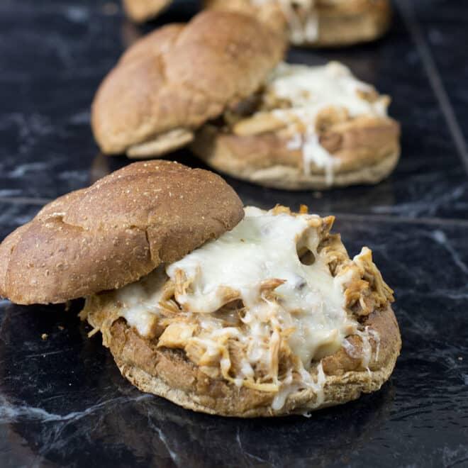 BBQ pulled chicken sandwiches with melted mozzarella cheese.
