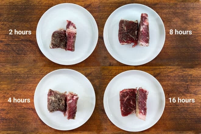 4 plates with a dry brined and cut steak on each with time labels for each steak.