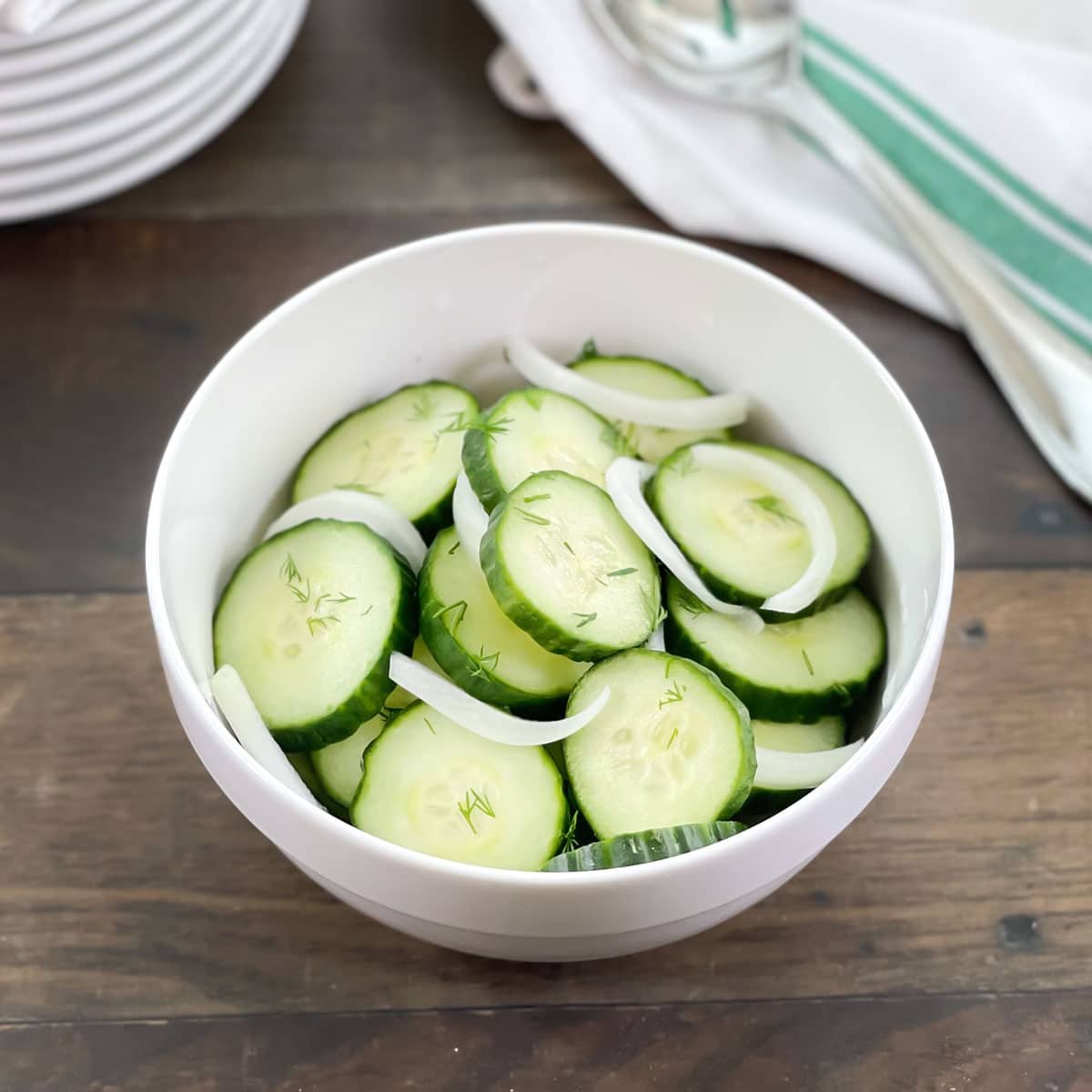 Cucumber Onion Salad in a white bowl.
