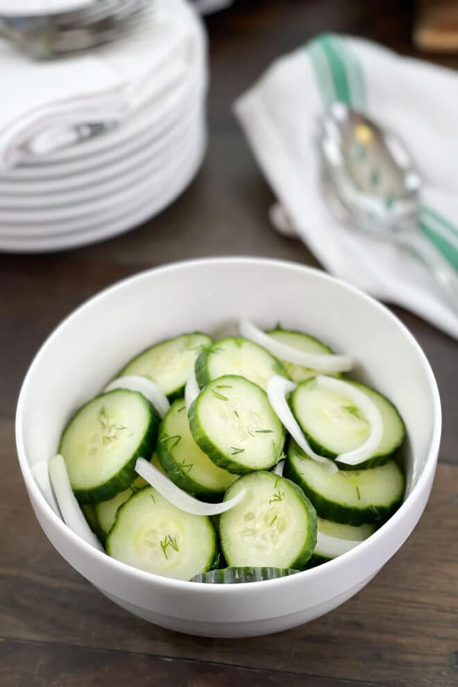 Cucumber Onion Salad in a white bowl.