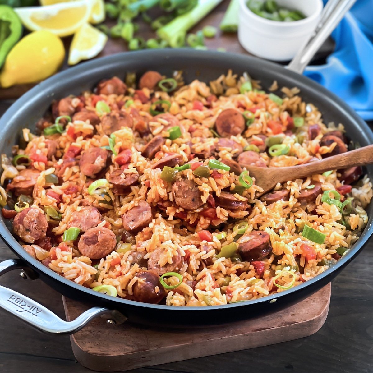 Sausage and Rice Skillet meal with tomato, bell pepper, and green onion.