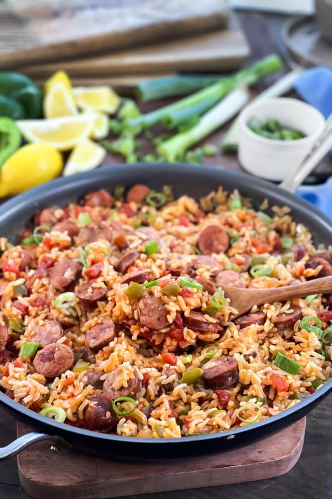 Sausage and Rice Skillet meal with tomato, bell pepper, and green onion.