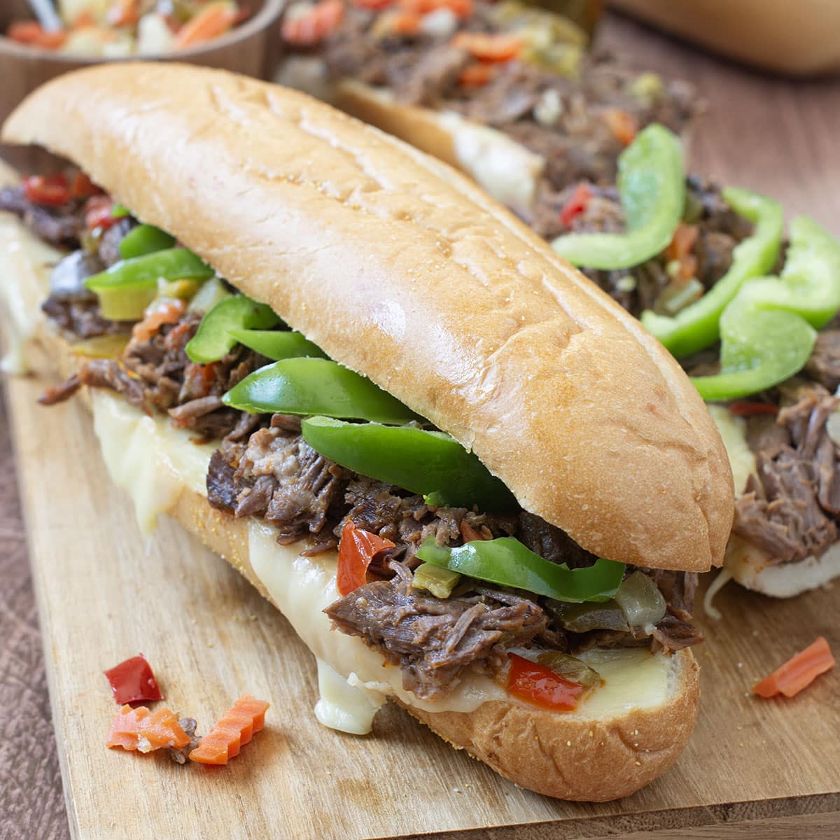 Shredded Beef Sandwiches with green peppers and melted cheese.