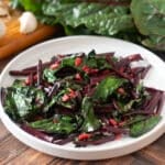 Garlicky Sauteed Beet Greens on a white plate.