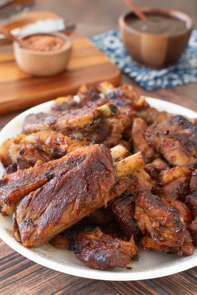 White platter of BBQ spare ribs.